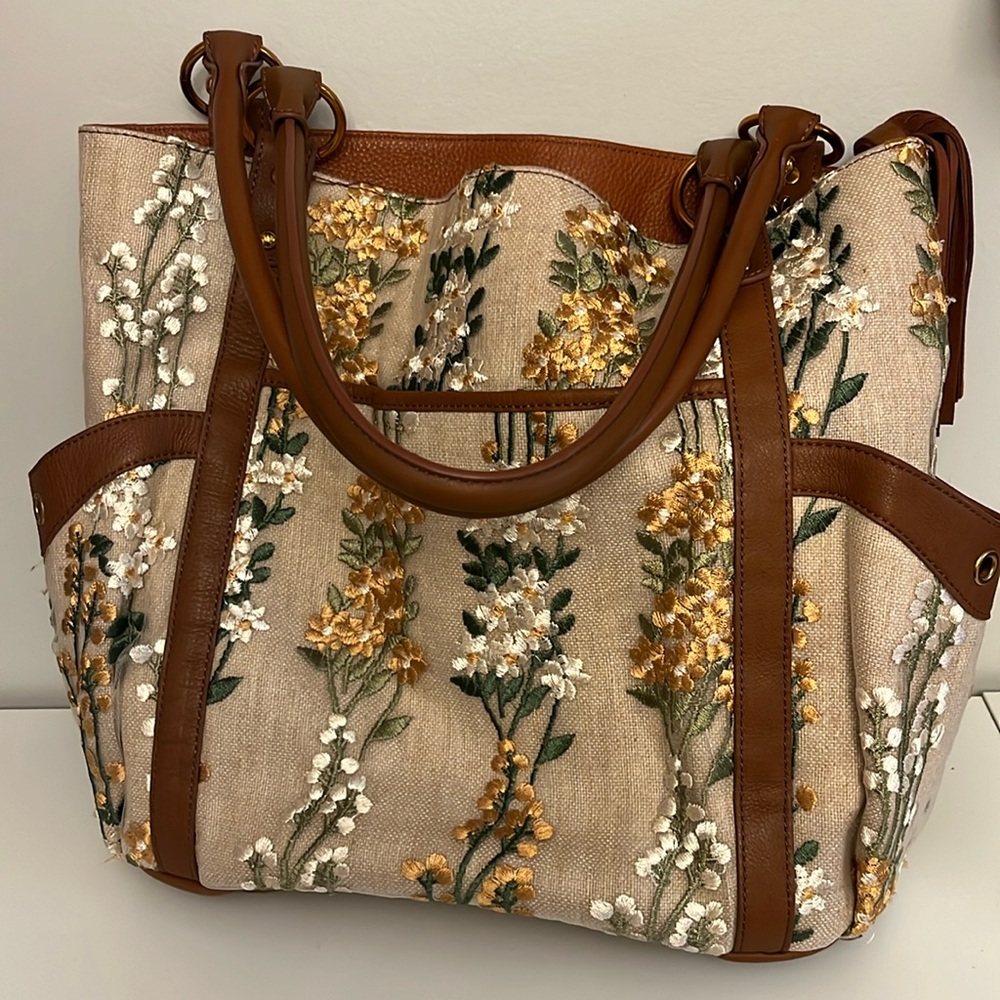 Sharif hand bag with brown leather and floral detailing